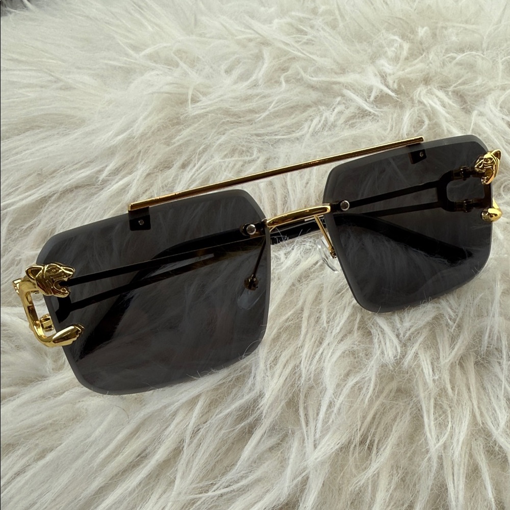 Elegant Black Sunglasses with Gold Panther Detail
